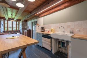 a kitchen with a sink and a counter top at La Ketzerie à Adervielle in Adervielle