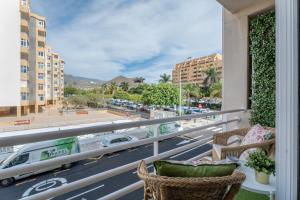 a balcony with a view of a city street at Apartamento Marte Centro in Los Cristianos