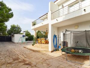 a house with a swimming pool on the side of it at Naizan in L'Ametlla de Mar