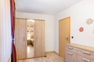 an empty room with a door and a bedroom at Ferienwohnung Göpfert in Weyhers +20 photos
