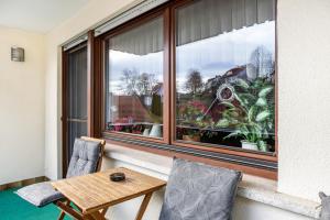 a room with a table and chairs and a window at Ferienwohnung Göpfert in Weyhers