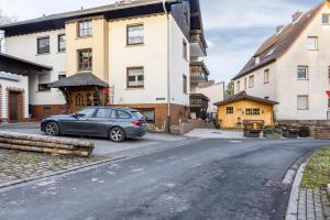 a car parked on the side of a street at Ferienwohnung Göpfert in Weyhers