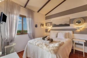 a bedroom with a bed with two stuffed animals on it at Casa La Bobadilla in Agulo