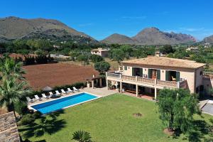 an aerial view of a house with a swimming pool at Can Seguinot in Pollença