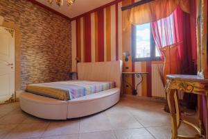 a bedroom with a bed and a window at Villa Chanel in Monteroni di Lecce +23 photos