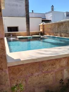 a swimming pool on the roof of a building at Villa Chanel in Monteroni di Lecce