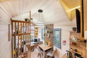 a living room with a couch and a table at Tiny House Ingo John 'Speedy' in Sandstedt