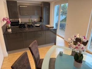 a kitchen with a table and chairs and a counter at Ferienwohnung Steni in Wehr