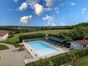 an overhead view of a swimming pool in a yard at Gite La Mauratie -4 chambres in Jayac