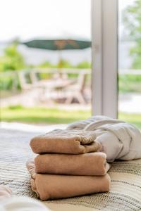 a pile of towels sitting on top of a table at Haus Seeblick in Langballig +34 photos
