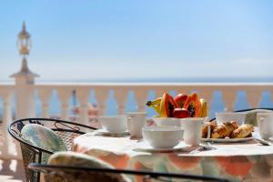 a table with a plate of food on top of it at House Carla Private Pool Heated in Puerto de Santiago