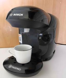 a coffee maker with a cup on aucer at Gîte de Rosemont in Saint-Pol-sur-Ternoise