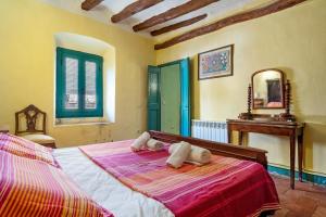 a bedroom with a bed with two pillows on it at Bonastre in Bonastre +32 photos