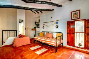 a bedroom with a bed in a room at Amarilla in Callosa d'en Sarrià +29 photos