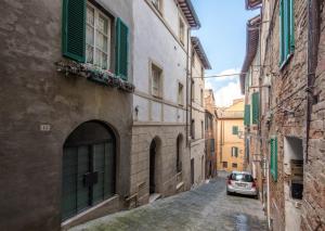 a car parked on a street in an alley at Il Campo Comfort apt with balcony in Siena