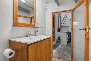 a bathroom with a sink and a mirror at La casa de la Sariera in Jávea +15 photos