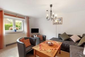 a living room with a couch and a table at Ferienwohnung Lichte in Medebach