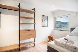 a bedroom with a bunk bed and a window at Moselbude Kröv mit Sauna in Kröv