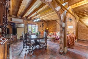 a kitchen and dining room with a table and chairs at La Tarja in Martín Miguel