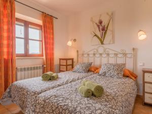 a bedroom with two beds with towels on them at Ses Mires in Santanyi +18 photos