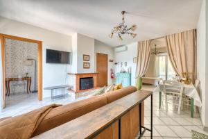 a living room with a couch and a fireplace at Umbria Casavacanze Vista Panoramica in Montefranco