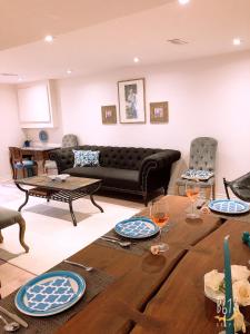 a living room with a couch and a table at Cozy 2bedroom Basement unit in Toronto