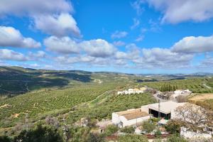 an aerial view of a farm in the hills at Casa Rural Martemma in Zuheros