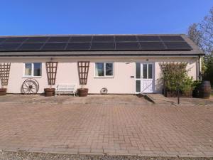 a house with a lot of solar panels on it at The Turbles - Wagtail in Castlemorton