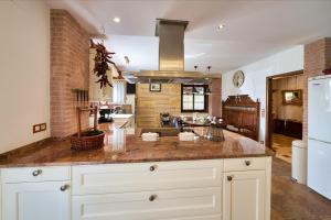 a large kitchen with a large island in the middle at The Basque Experience by Fidalsa in Ochandiano