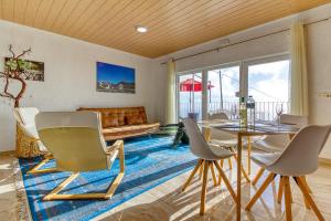 a living room with a table and chairs and a couch at Hotel Rural Los Piratas in Tijarafe