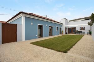 a white and blue house with a yard at Casa D'Avó - Family Coastal Escape in Casa Nova