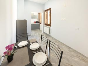 a dining room with a table with chairs and a refrigerator at Casa Bella Venezia 1 in Mestre +28 photos