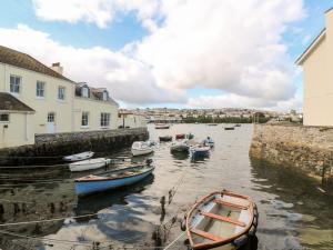 a group of boats are docked in a harbor at Widgeons Keel in Falmouth