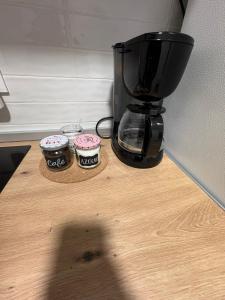 a coffee maker sitting on top of a wooden table at Rincon del puerto I in A Guarda +47 photos