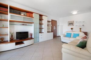 a living room with a couch and a tv at Casa Andrea in Venice