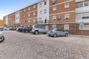 a group of cars parked in a parking lot at Encanto Costero in Ayamonte
