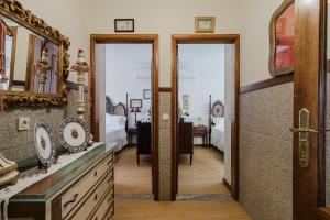 a room with two doors and a mirror at Quinta do Passal - Gondoriz in Gondoriz +36 photos