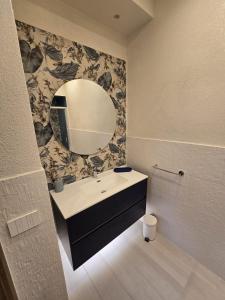 a bathroom with a sink and a mirror at Casa Mia Holiday House in Pianillo +44 photos