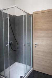 a shower with a glass door in a bathroom at Koala Hostel in Milan +30 photos