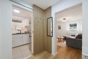 a kitchen and a living room with a sliding door at Ferienwohnung Auszeit in Calw