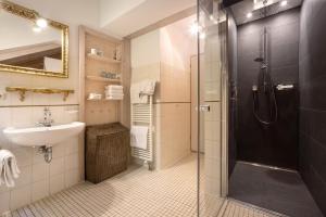 a bathroom with a shower and a sink at Ferienhaus Chalet Montfort in Sonthofen +29 photos