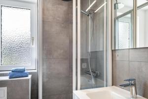a bathroom with a shower and a sink at Strandnahe Fewo 1 in Dierhagen +22 photos