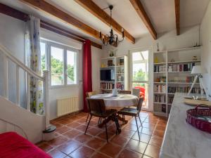 a kitchen and dining room with a table and chairs at Gites Air Marin in Lannion