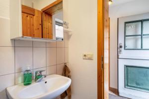 a bathroom with a sink and a window at Schnyder Ranch in Ravensburg +136 photos