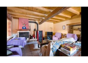 a living room filled with furniture and a fireplace at Casa Llano in Llano de Bureba
