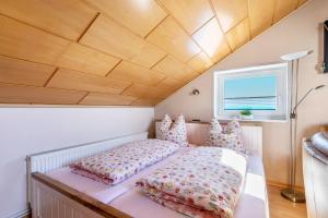a bedroom with a bed and pillows in a room at Alte Schmiede in Kuden
