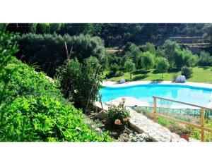 a view of a swimming pool in a garden at Cortijo El Plantío Castril in Castril