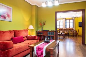 a living room with a couch and a table at Casa Rural Doña Manuela in Valdemierque