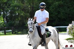 a man is riding a white horse at Grand Gîte Avec 2 Chambres in Saint-Pol-sur-Ternoise