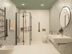 a bathroom with a shower and a sink and a toilet at Mercure Milano Agrate Brianza in Agrate Brianza